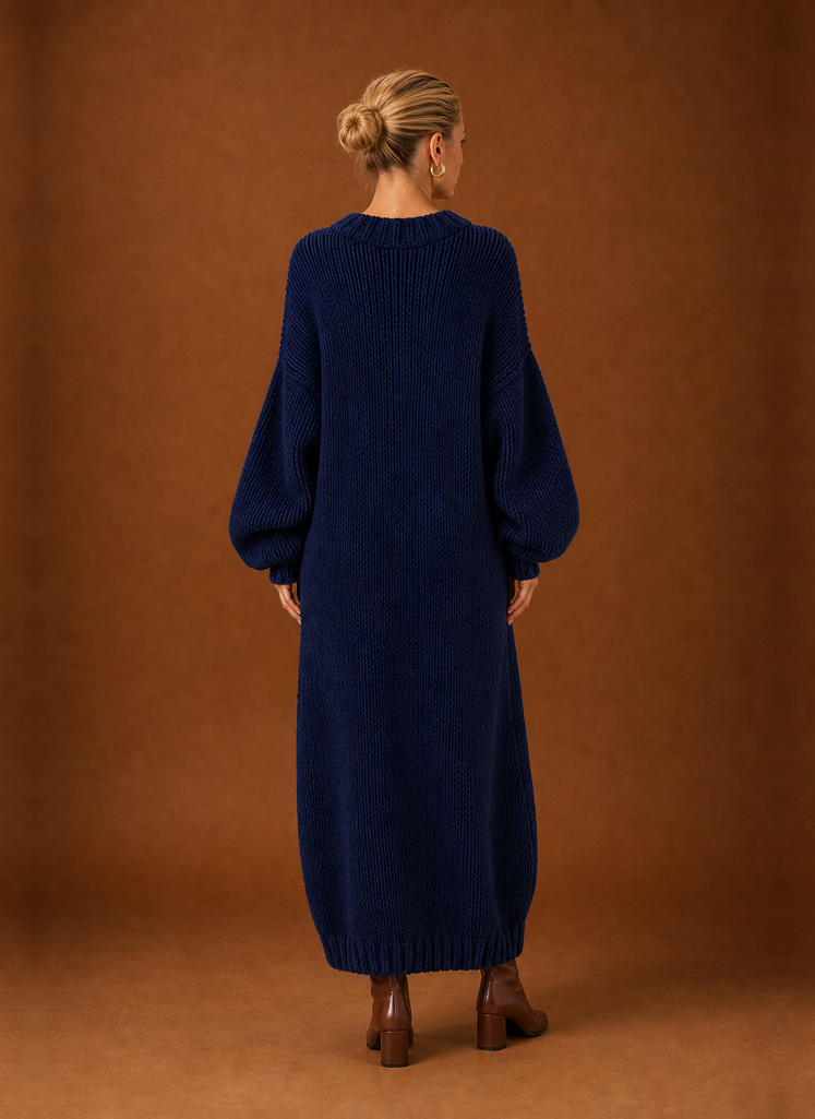 Back view of the knit maxi dress highlighting the full-length silhouette