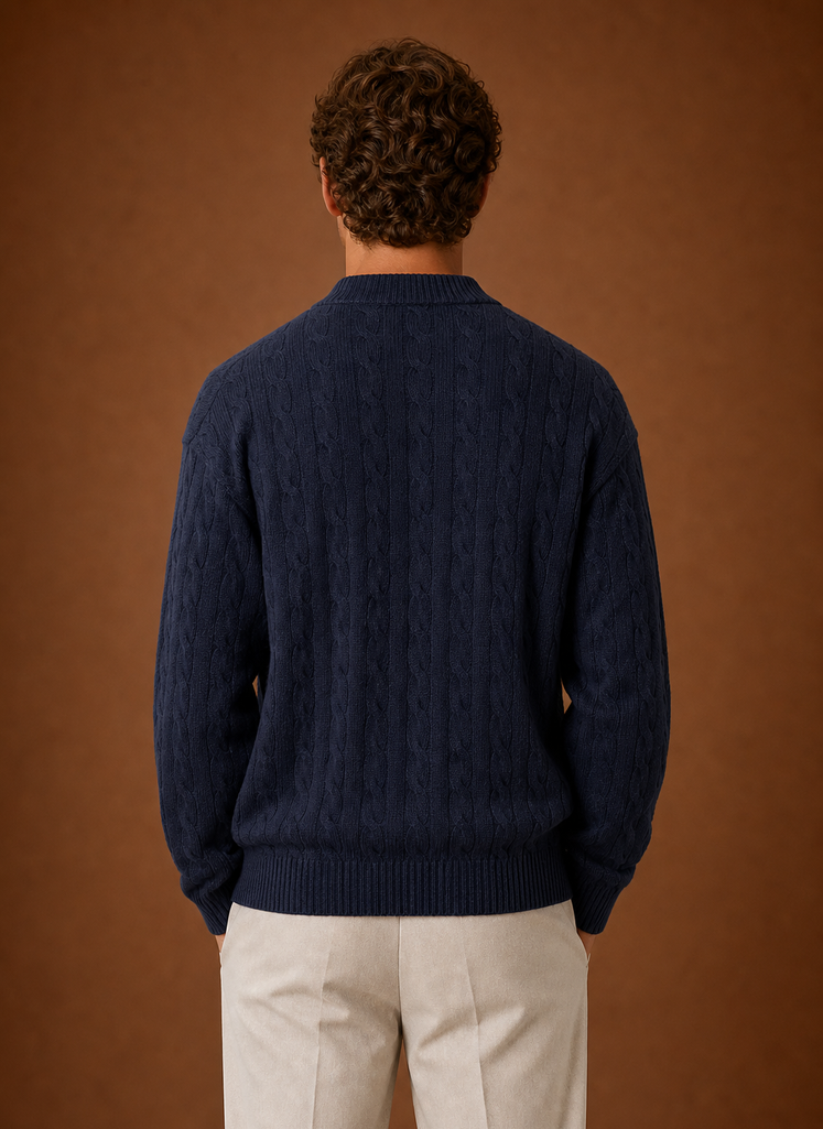 Back view of men's cable knit cardigan showing cable knit texture