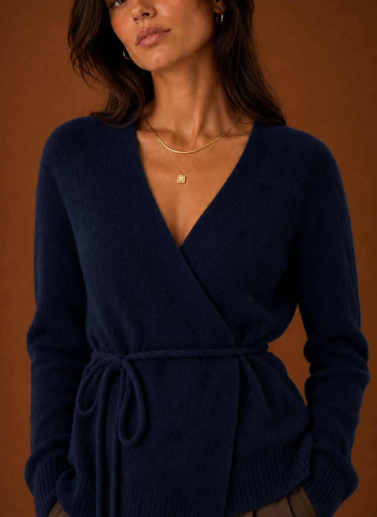 Close-up of the tie waist belt and knit texture on the women's wrap cardigan