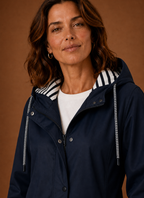 Close-up of hood and collar area of the women's trench coat with visible stitching detail