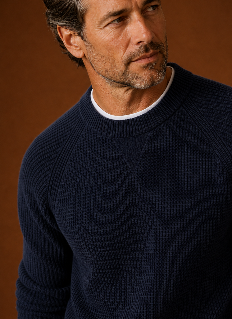 Close-up of textured waffle knit pattern and crew neckline on Areleon men's sweater