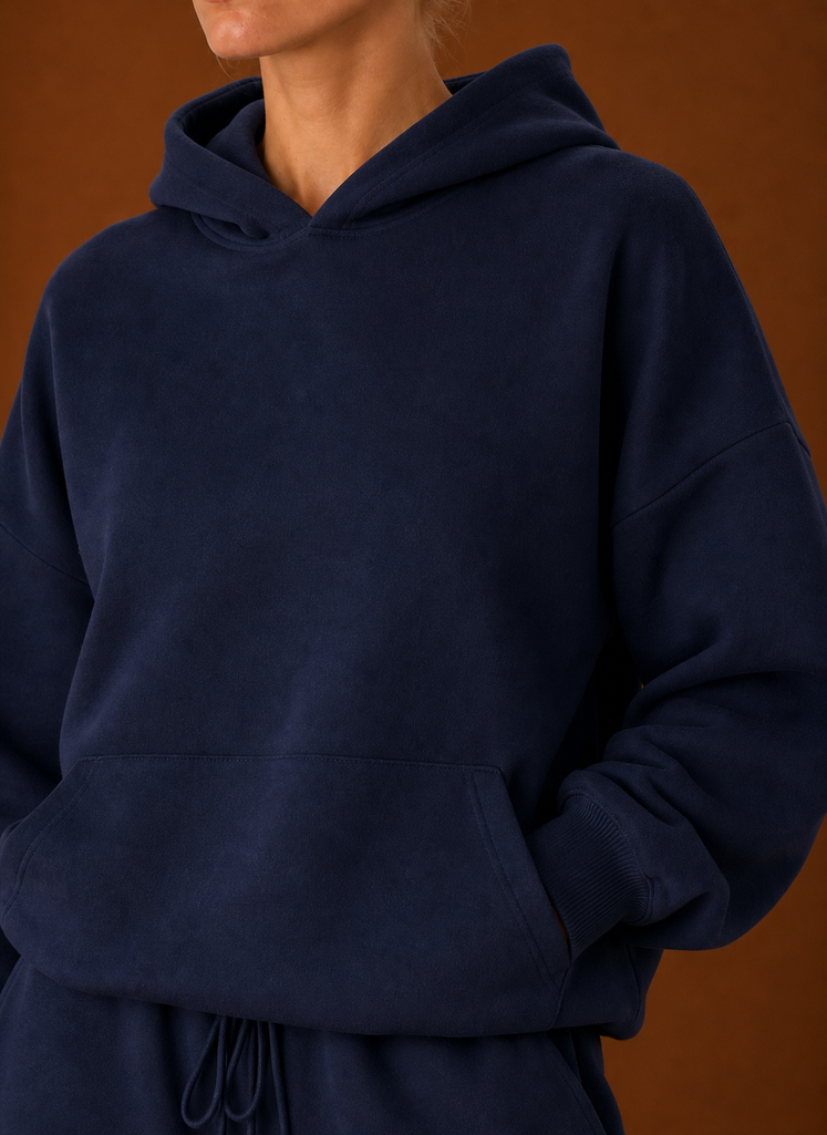 Close-up of the sweater and pants showing fabric texture and seam details