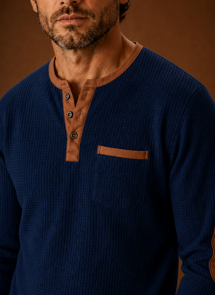 Close-up of waffle knit texture and Henley button placket on the shirt