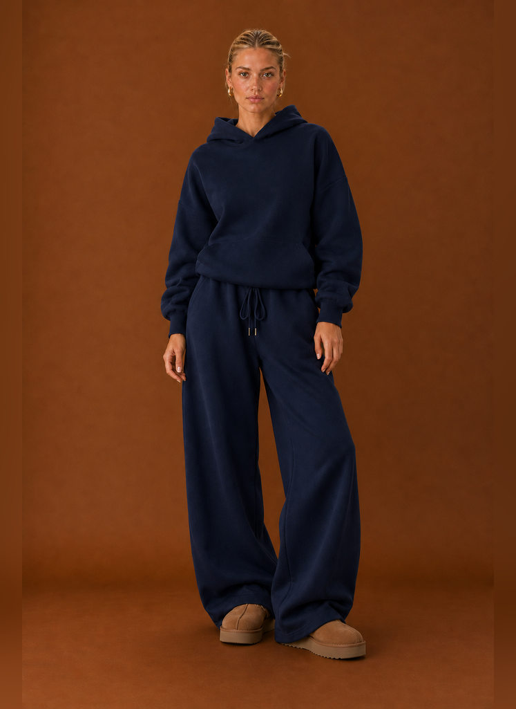 Front view of two-piece sweatsuit set showing sweater and pants on a model