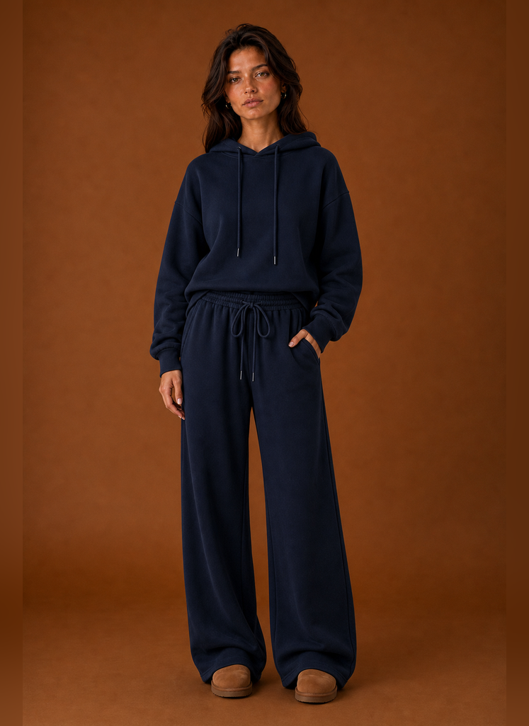 Front view of a women's two-piece sweatsuit set showing sweatshirt and matching pants on a mannequin