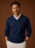 Front view of men's V-neck knit sweater in navy