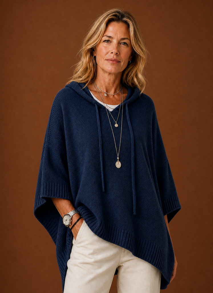 Front view of oversized hooded pullover on mannequin showing hood and relaxed fit