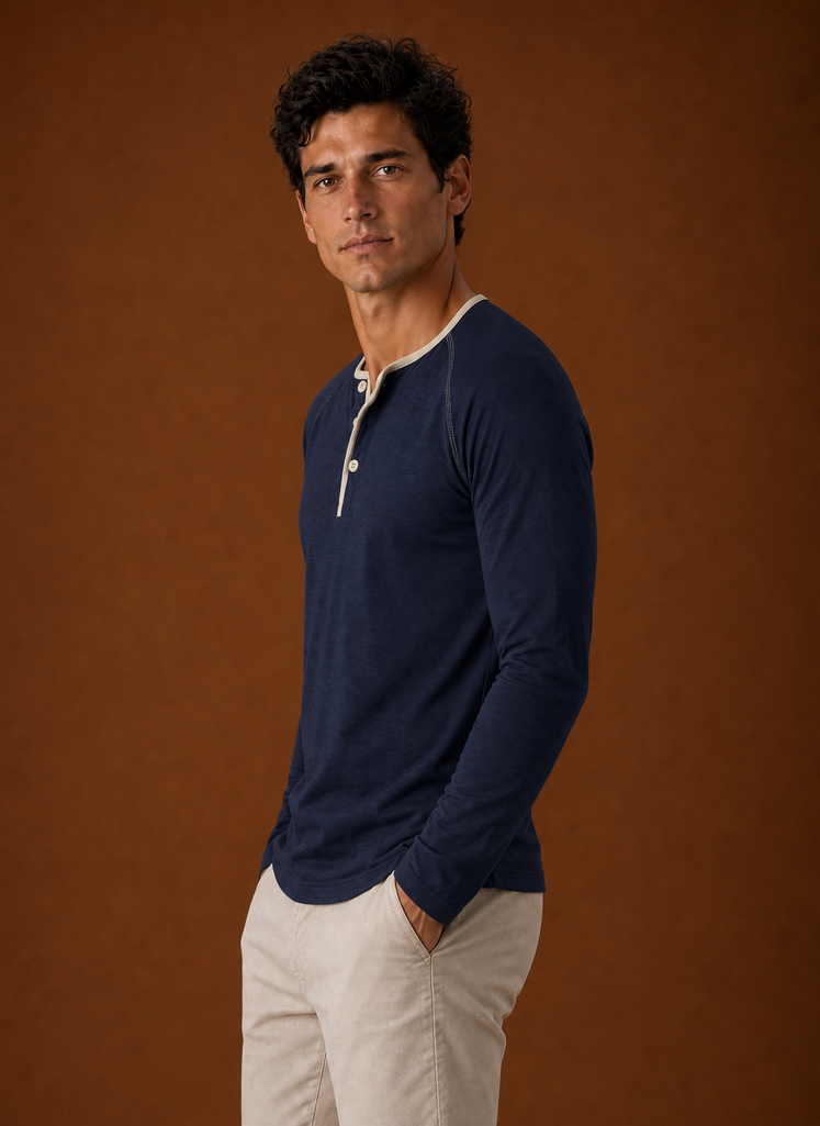 Side view of a men's Henley shirt displaying fit and sleeve line