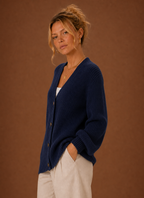 Side view of women's V-neck knit cardigan showing sleeve drape and silhouette