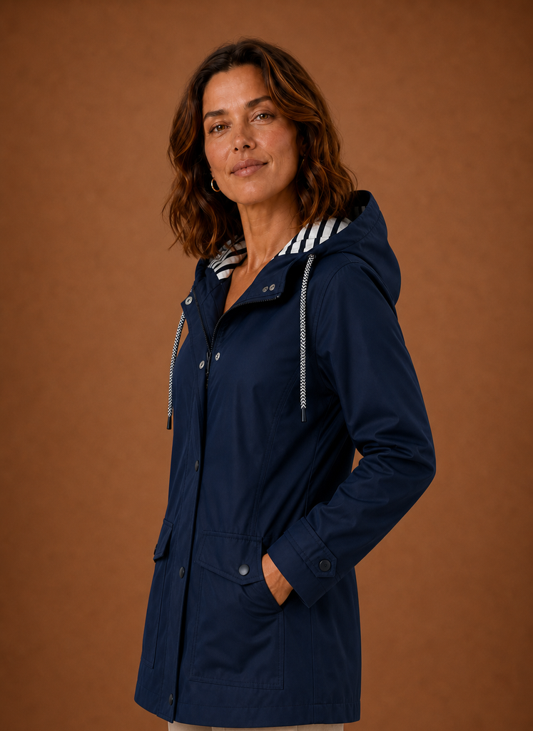 Side profile of women's hooded trench coat highlighting sleeve length and straight fit