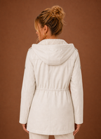 Back view of the long women's parka jacket with hood