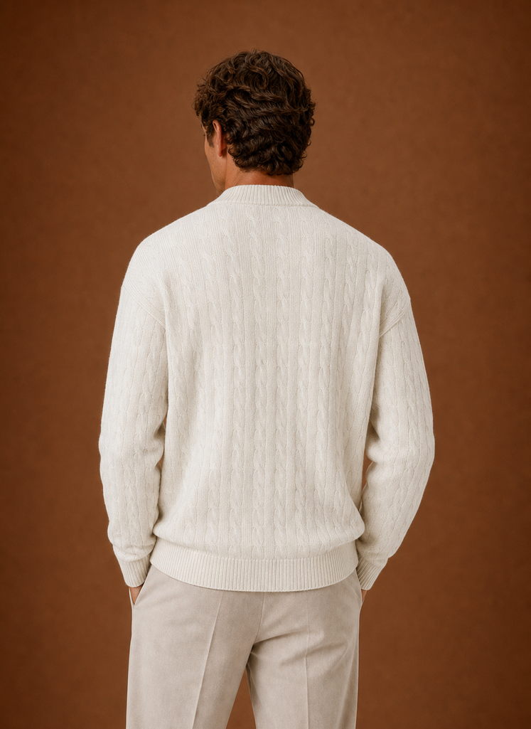 Back view of men's cable knit cardigan showing cable knit texture