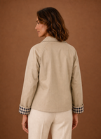 Back view of cardigan displaying hip-length fit and clean back detail