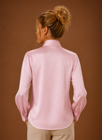 Back view of women's V-neck sweater showing clean finished hem and straight back silhouette