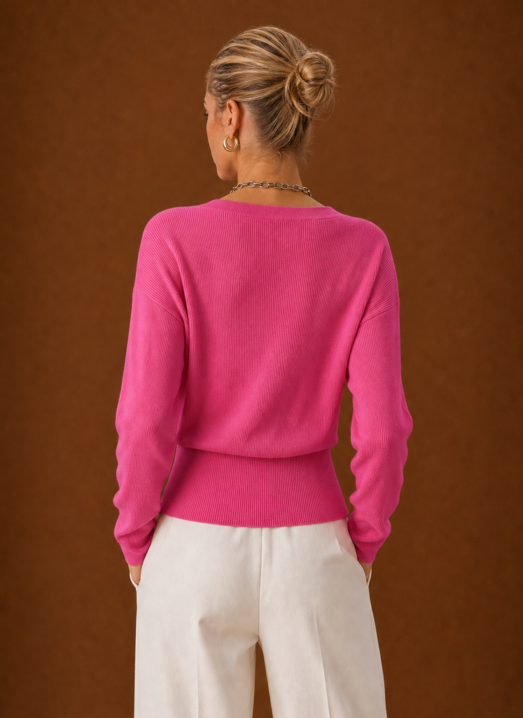 Back view of women's wrap sweater with clean hemline