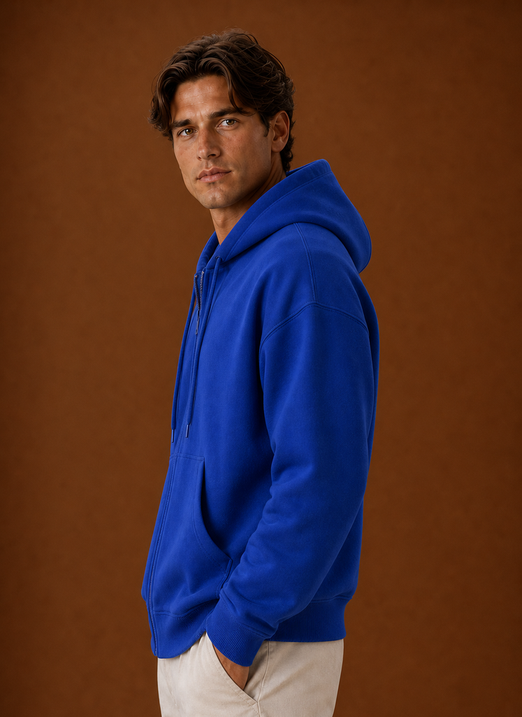 Side view of hoodie highlighting the attached hood and zip closure