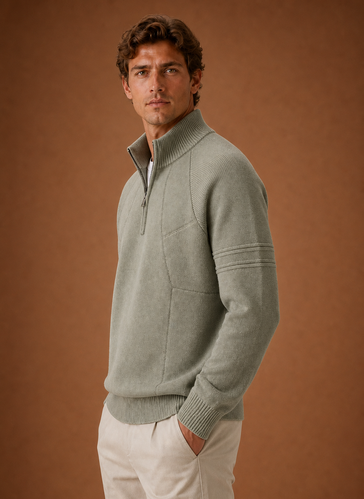 Side profile of men's half-zip knit sweater showing the zip neckline and sleeve