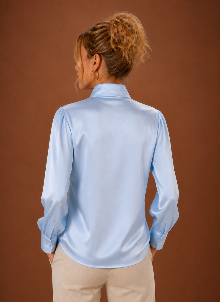 Back view of women's V-neck sweater showing clean finished hem and straight back silhouette
