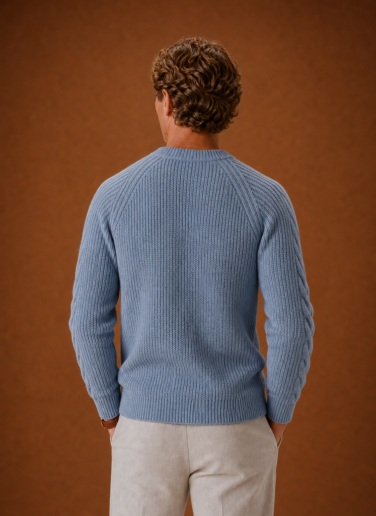 Back view of a men's cable knit crewneck sweater in sky blue