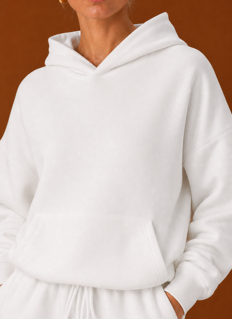 Close-up of the sweater and pants showing fabric texture and seam details