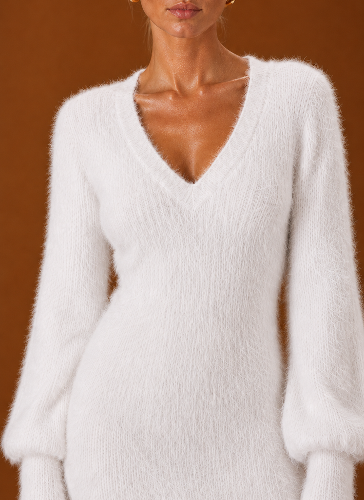 Close-up of Areleon sweater dress showing ribbed cuff and hem detail