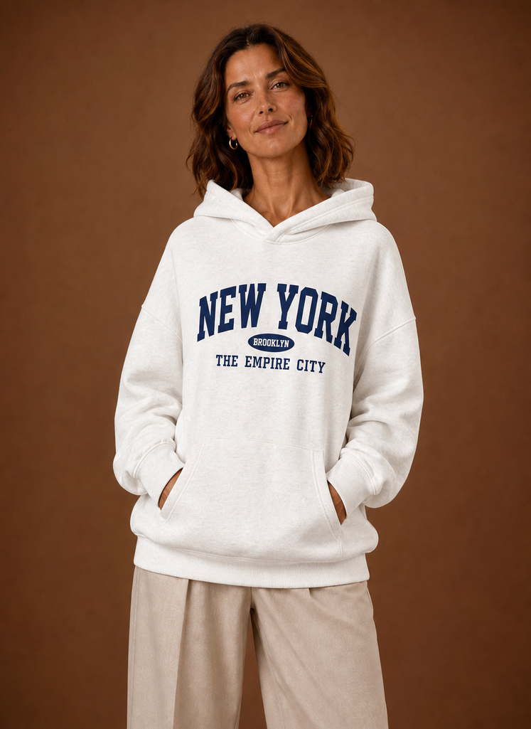 Front view of women's oversized hoodie with New York graphic on the chest