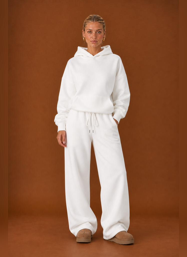 Front view of two-piece sweatsuit set showing sweater and pants on a model