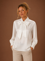 Front view of women's V-neck sweater on a mannequin showing the V-neckline and relaxed silhouette