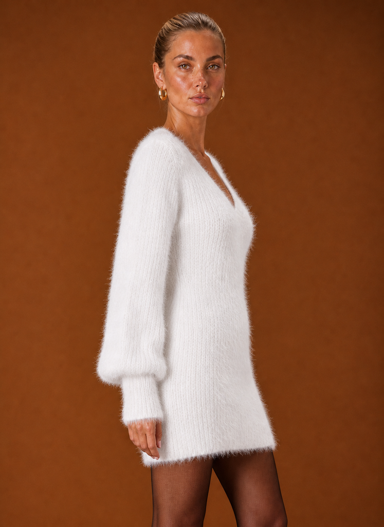 Side view of Areleon sweater dress highlighting sleeve length and relaxed fit