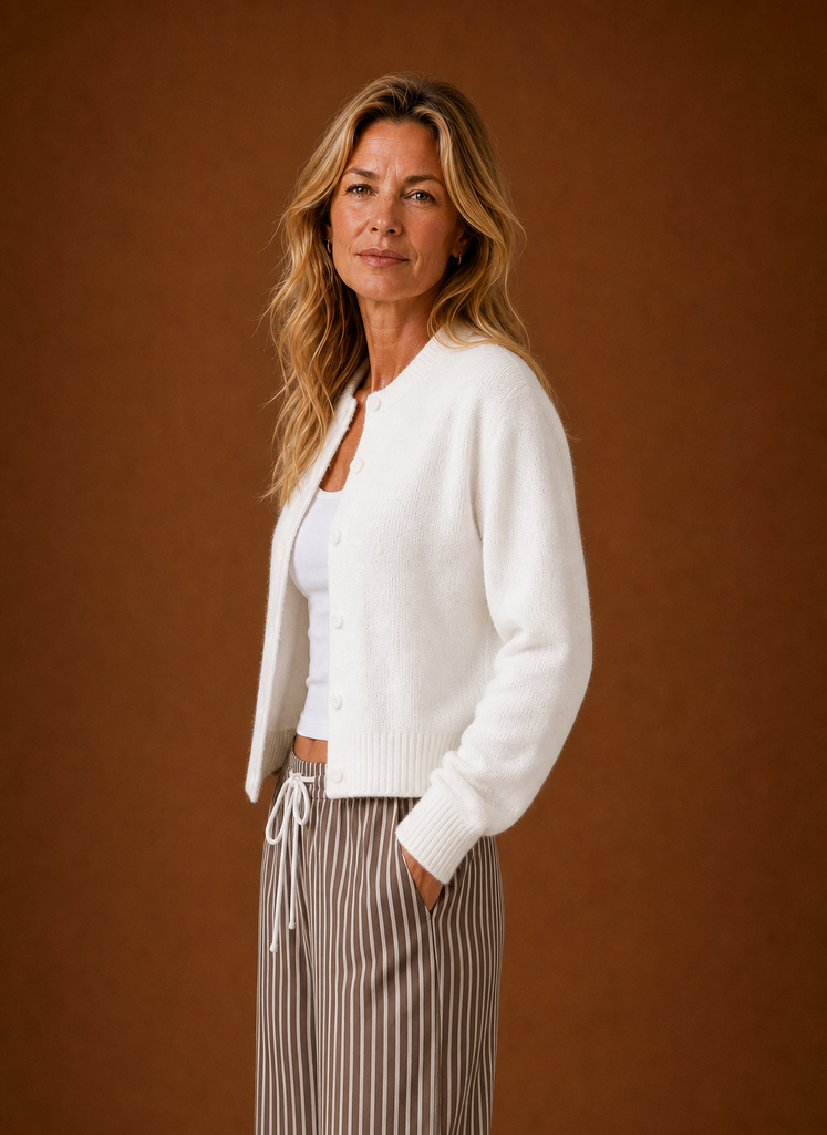 Side view of the women's crew neck cardigan showing the sleeve and button closure