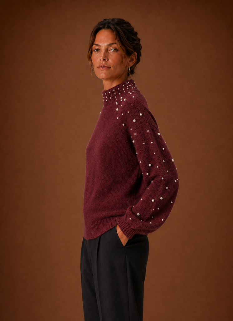 Side view of women's pearl embellished knit pullover showing silhouette