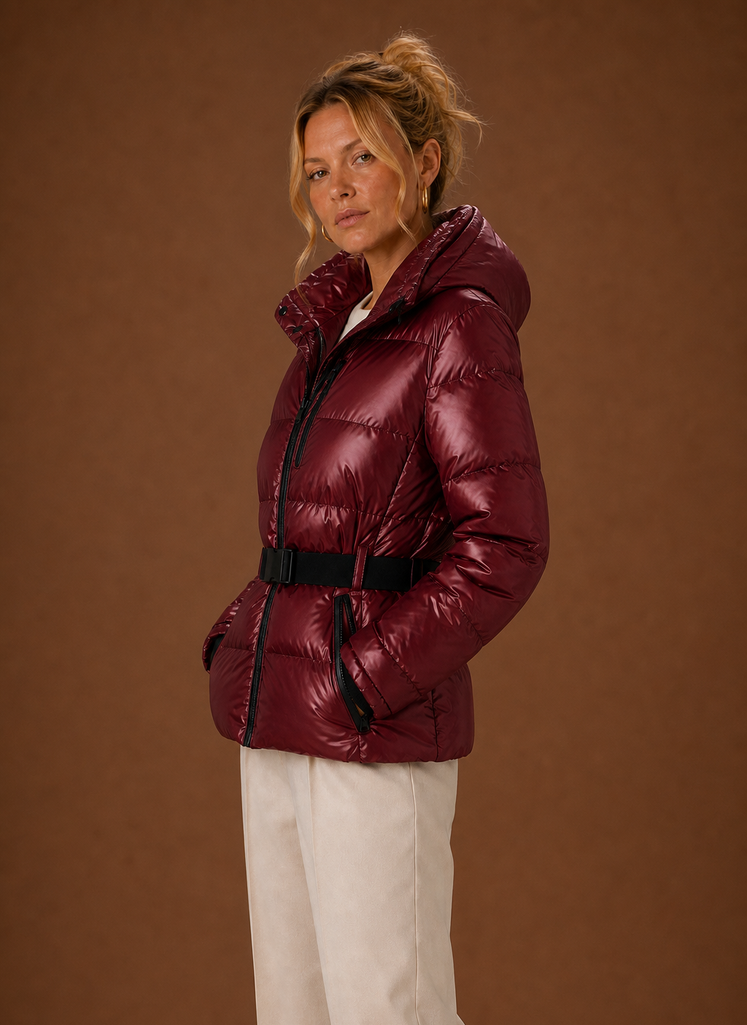 Side profile of metallic hooded puffer jacket showing hood and sleeve silhouette