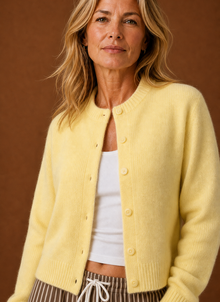 Close-up of the cardigan's button-front and knit texture